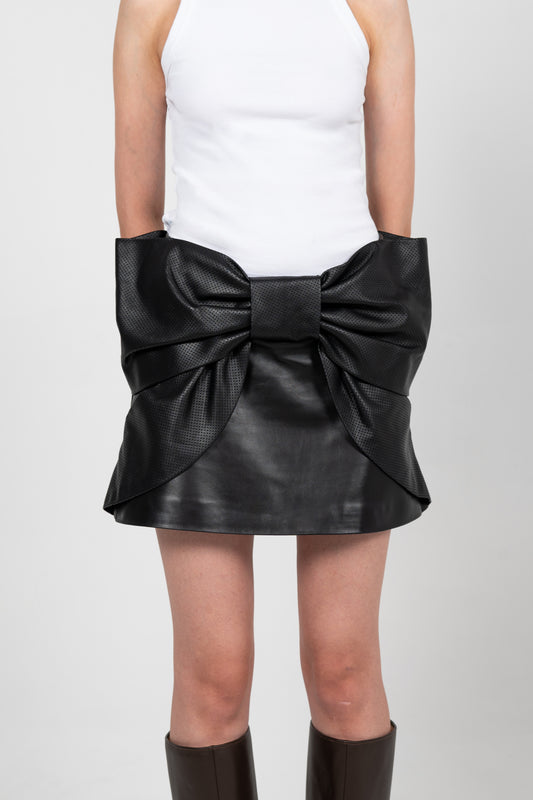 MERADA LEATHER BOW SKIRT IN BLACK