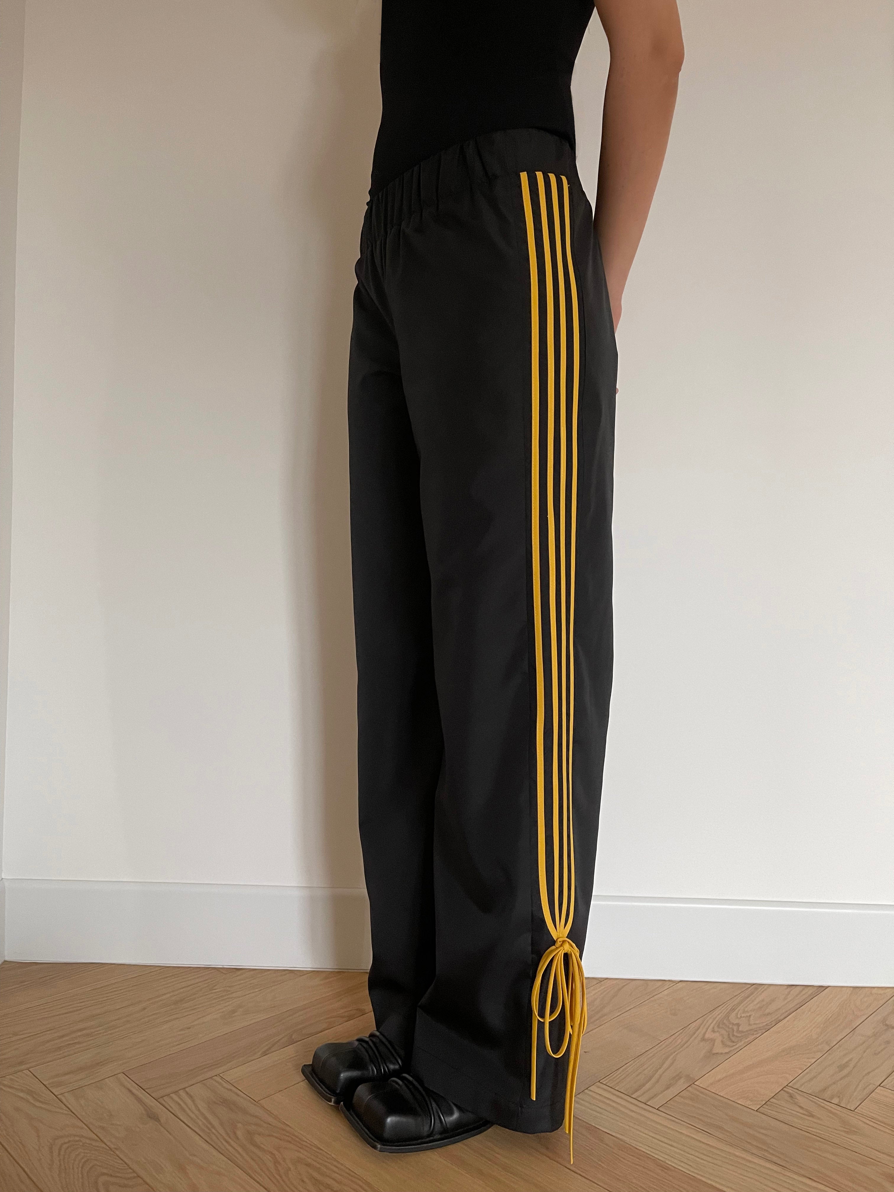 Black trousers yellow stripe hotsell